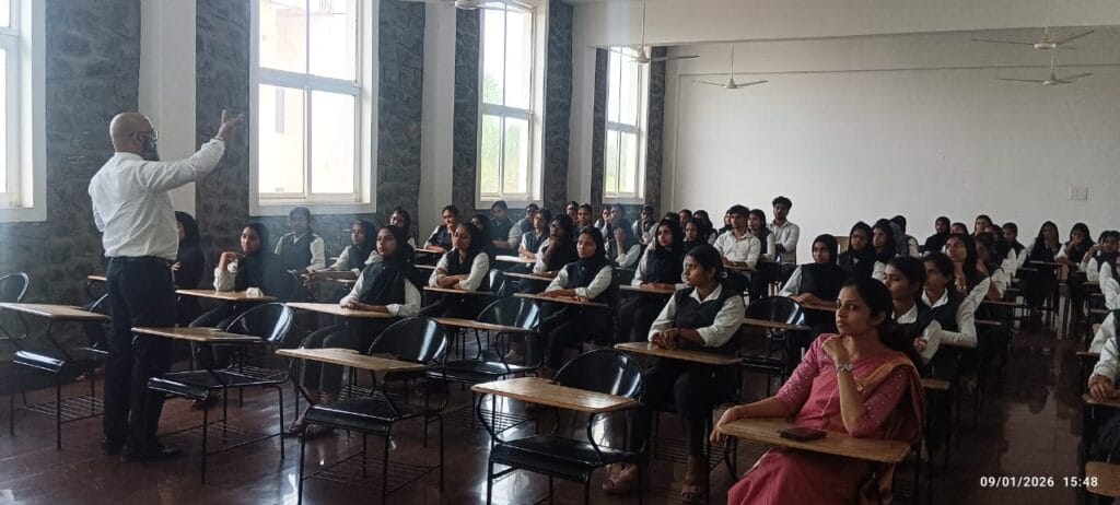 VInu Das taking a seminar at a college