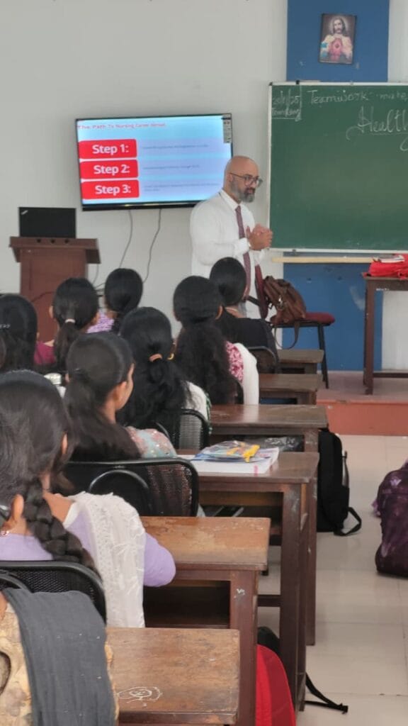 VInu Das taking a seminar at a college