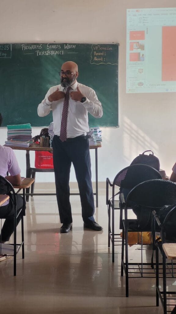 VInu Das taking a seminar at a college