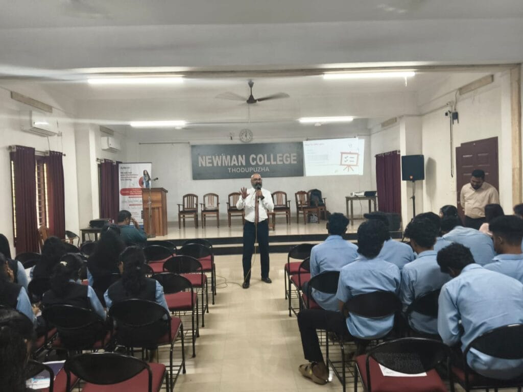 VInu Das taking a seminar at a college