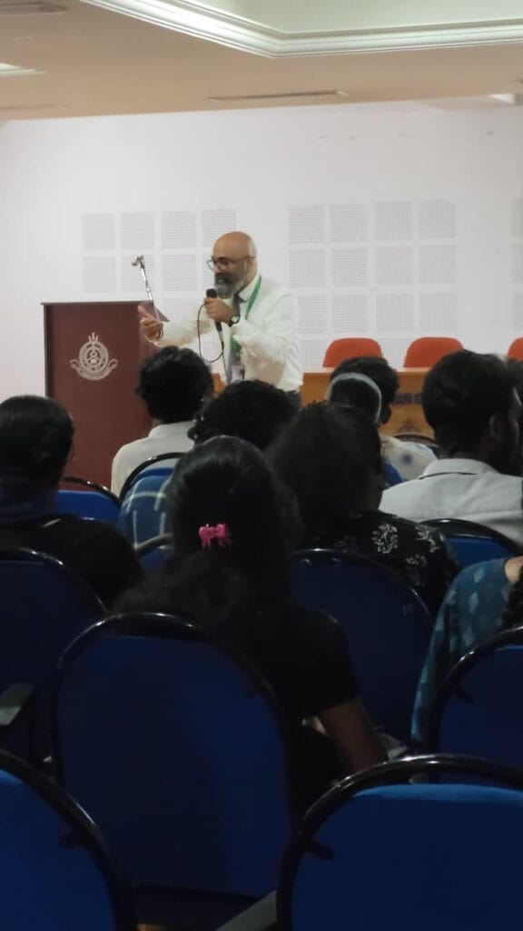 VInu Das taking a seminar at a college