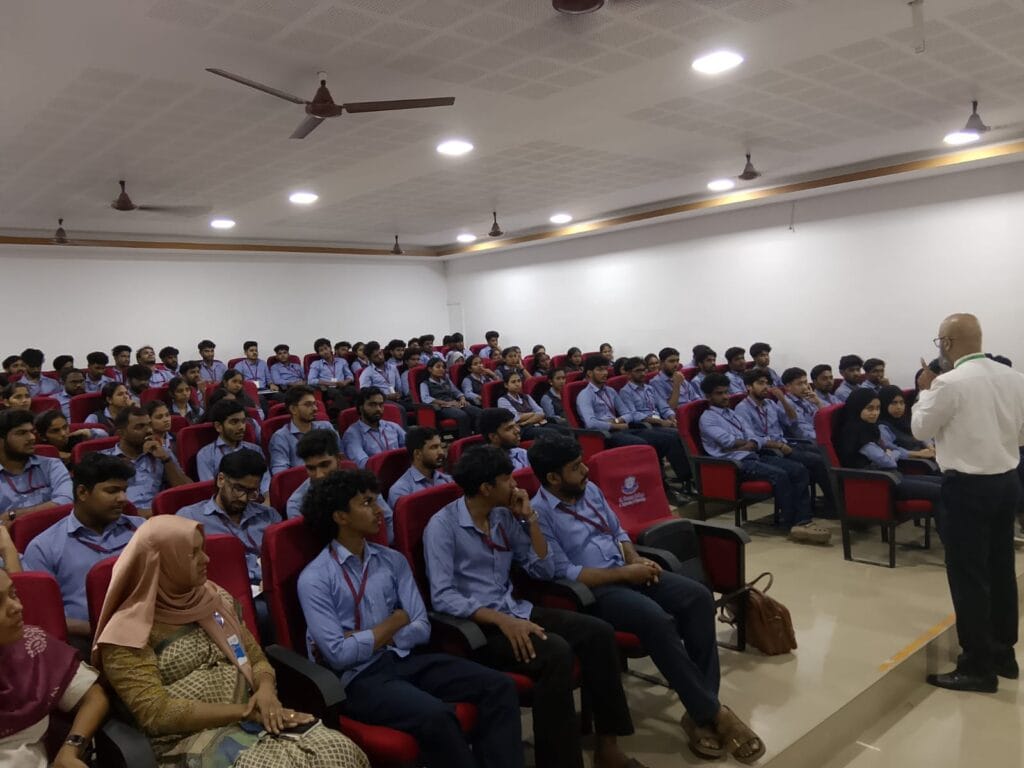 VInu Das taking a seminar at a college