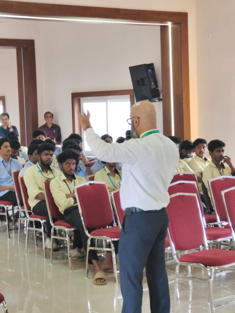 VInu Das taking a seminar at a college