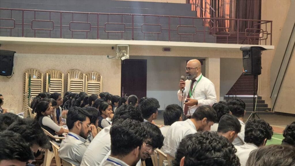 VInu Das taking a seminar at a college